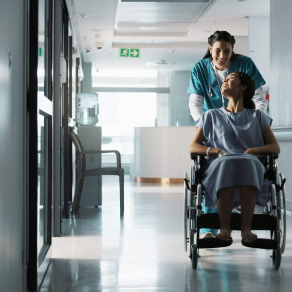 happy-nurse-wheelchair-patient-and-people-talking-2025-04-05-22-51-11-utc Happy nurse, wheelchair patient and people talking, consulting and motivation advice, kindness or e.